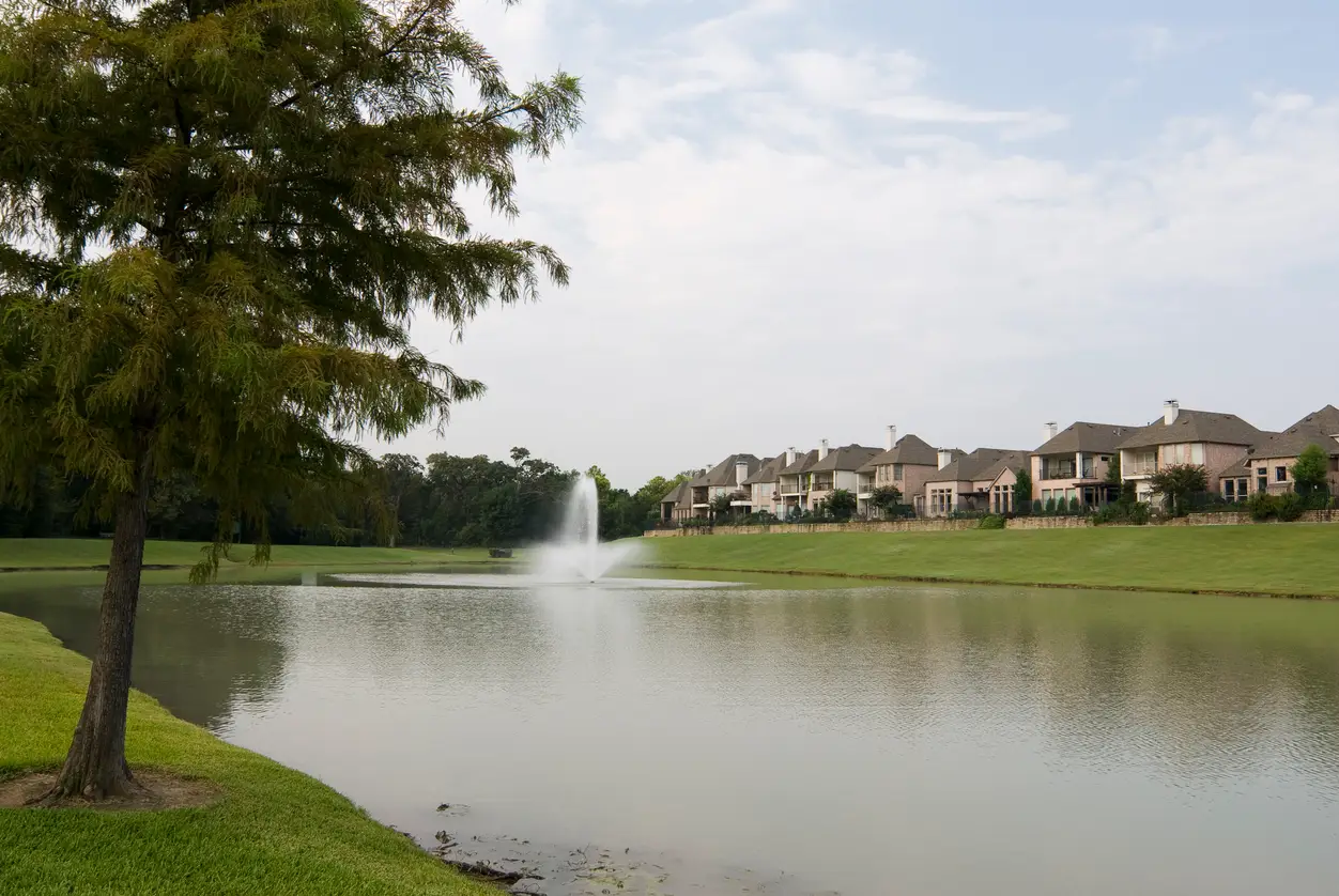 may 7,, houses lake sky tree with copy space for graphic artist this is a typical residential oasis in an american urban setting