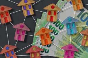 real estate concept with dollars and home model building activity construction industry and home owner association budget concept 1