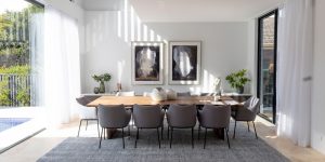 a dining room table with chairs around it